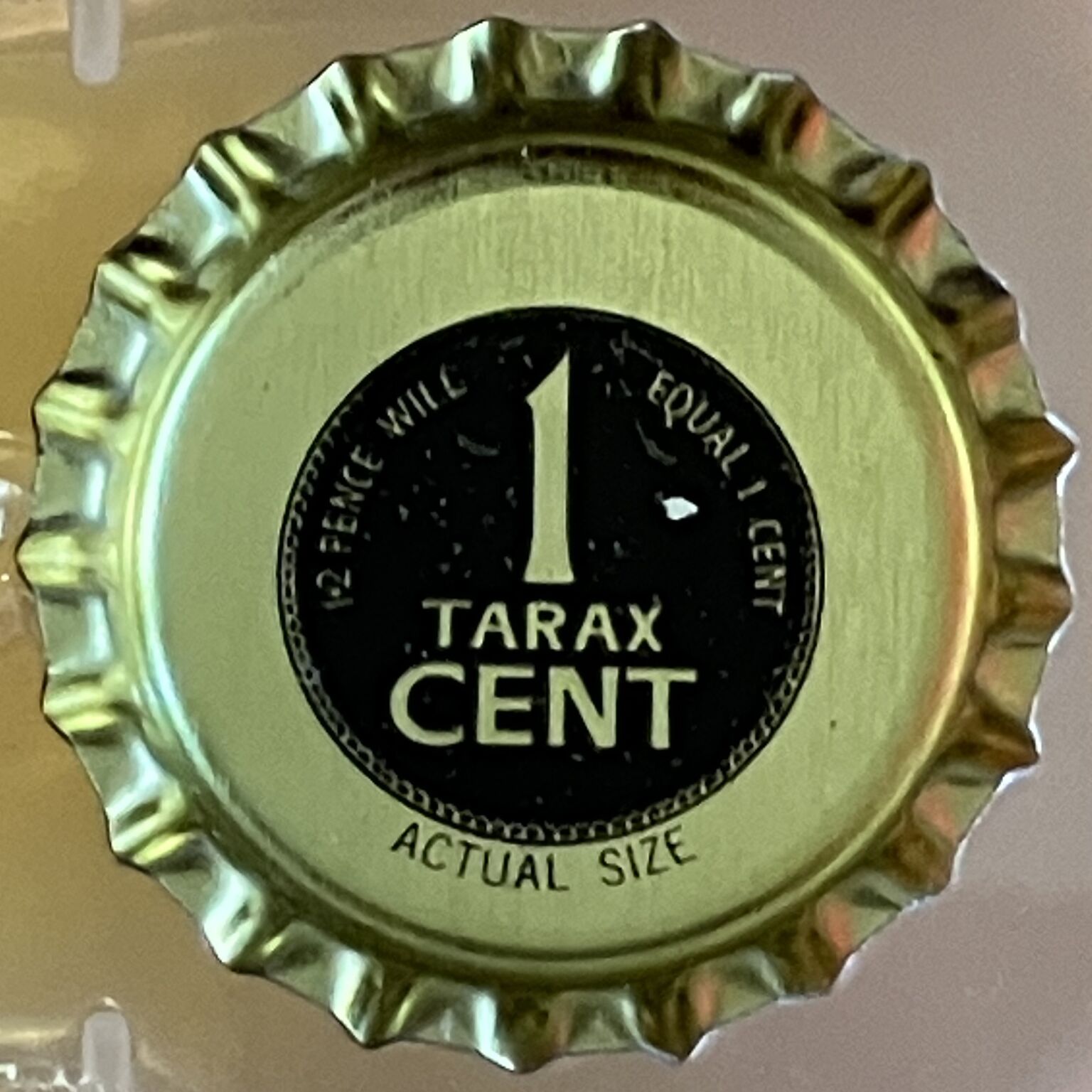Tarax bottle cap with actual-size Australian penny diagram